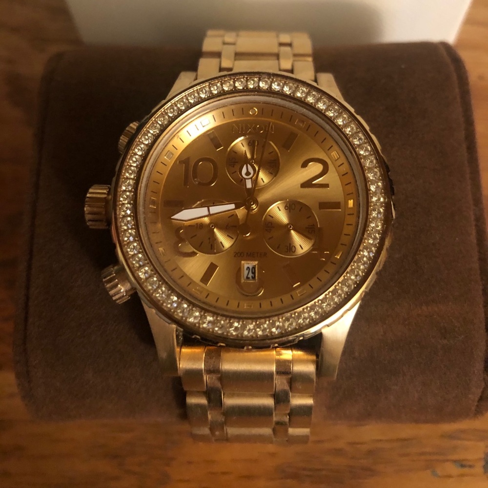 Nixon women’s gold watch